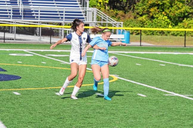 Chatham's Mia Semioli, left, and Sparta's Abigail Rodek are focused on the ball. Rodek scored the winning goal in overtime.