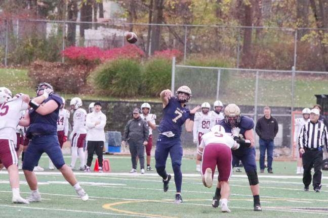 Pope John quarterback Christopher Dietrich (7) passes the ball.