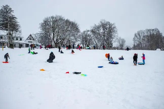 Last year, kids and adults alike, adorned in their colorful snow gear, flocked to Stanley Deming Park in Warwick for some afternoon sledding. Photo by Aja Brandt