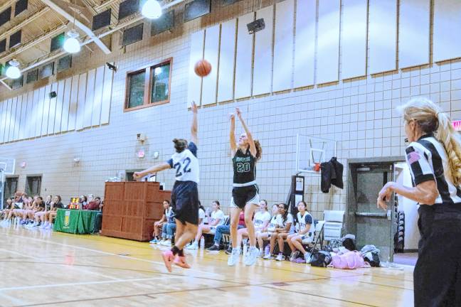 VR1 Veritas Christian's Madelyn Seifert (20) releases the ball during a shot. She scored 14 points in the Jan. 16 game against Trinity Christian School in Montville. Veritas won, 57-17. (Photo by George Leroy Hunter)