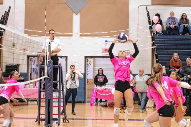 SV3 Sparta's Aralyn Saulys performs an overhead pass.