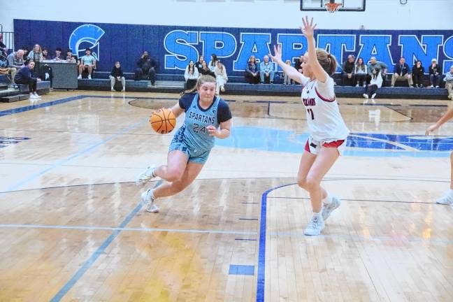 Sparta's Katie Sutton drives forward in the first half. She scored four points, grabbed six rebounds, made three assists and was credited with one steal.