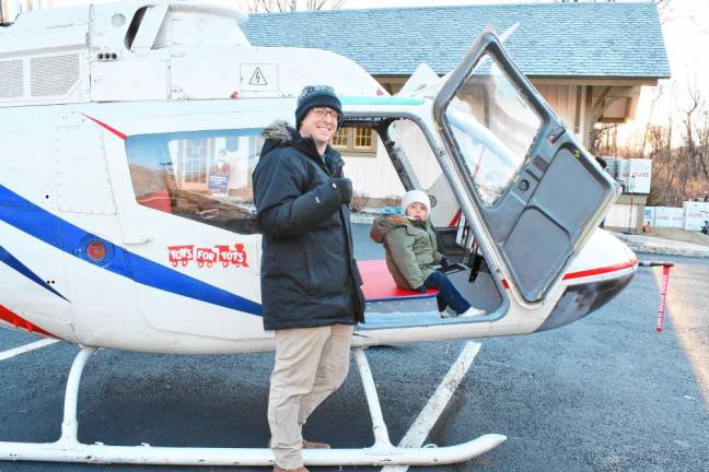 <b>OT4 Dan and Tom Nizolak of Sparta check out a Toys for Tots helicopter. (Photo by Maria Kovic)</b>