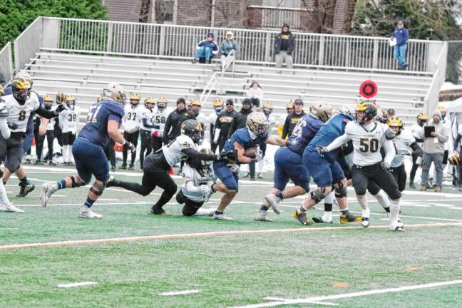 Pope John ball carrier Luke Gialanella follows his blockers as they make a lane for him to run through. Gialanella made one touchdown and rushed for 55 yards in the game.