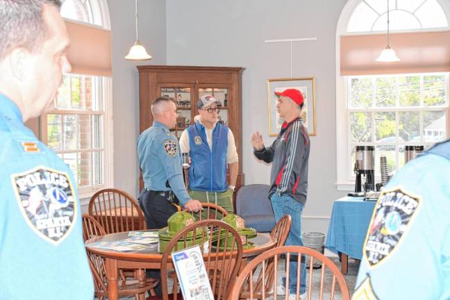 Sparta residents talk with police officers during a Coffee with a Cop event Wednesday, Oct. 3 at the Sparta Public Library. (Photos by Maria Kovic)