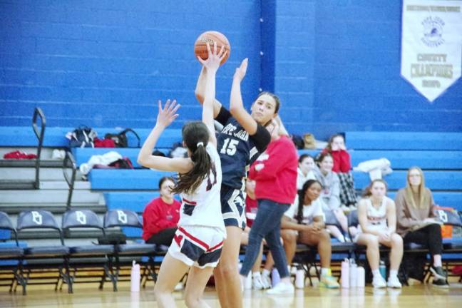 Pope John's Natalija Novkovic (15) attempts to pass the ball while covered by a West Morris Mendham defender in their game Friday, Jan. 24. Pope John won, 44-27. Novkovic scored four points, grabbed five rebounds and made two assists. (Photos by George Leroy Hunter)