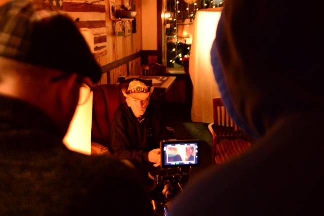 Actor Terry Michael Clarke, left, and director Kevan Ali watch as actor Bill McInerney is about to perform his scene.