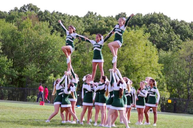 The Sussex Tech cheerleaders perform a balancing routine during halftime.