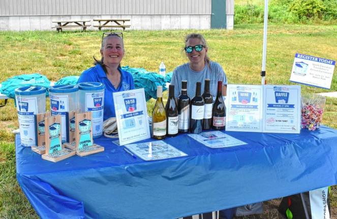 Selling raffle tickets are Kim Noel, left, and Heidi Byrnes, trustees of the Sparta Education Foundation.