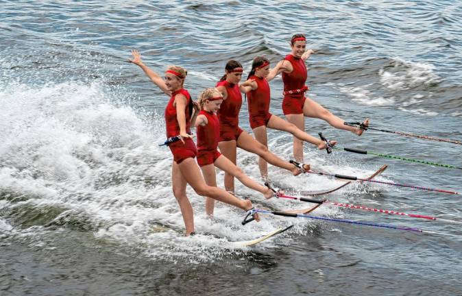 Meghan Lieb, Saige Lieb, Julia Smith, Reese Dalfol and Kate Sutphen perform a toe turn line during the Ski Hawks show on Lake Mohawk.