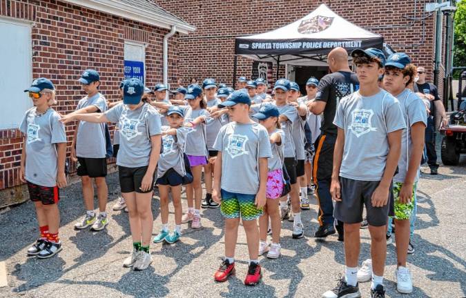 Junior Police Academy participants learn to space themselves in formation.