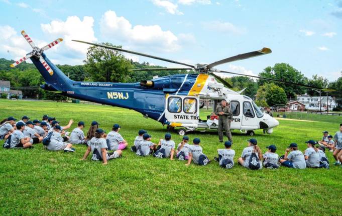 New Jersey State Trooper and helicopter pilot Paul Brocky talks to participants in the Sparta Township Police Department’s Junior Police Academy. (Photos by Nancy Madacsi)