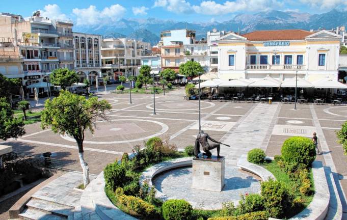 The main square of Sparta, Greece. The large white building is the old town hall, which is used for council meetings.