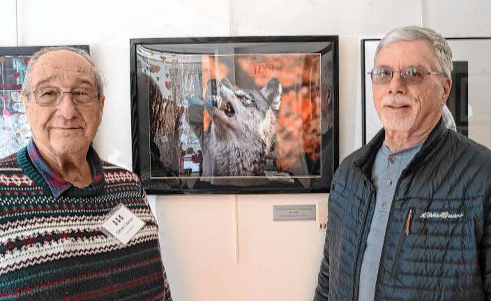 Jim Caiazzo and Frank Urbaniak in front of ‘Wolf vs. Spider.’