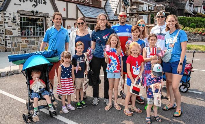 People decked out in red, white and blue gather for the Fourth of July Parade in Sparta.