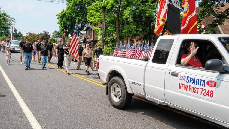 Members of Veterans of Foreign Wars Post 7238 in Sparta march in the parade.