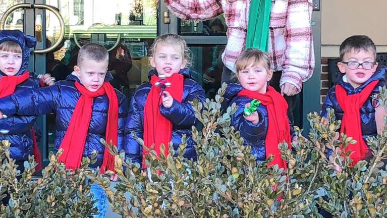 Students at Project Self-Sufficiency’s Little Sprouts Early Learning Center ring bells.