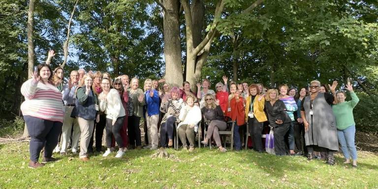 The staff at Karen Ann Quinlan Hospice gather at in in-service to celebrate National Hospice and Palliative Care Month. (Photo provided)