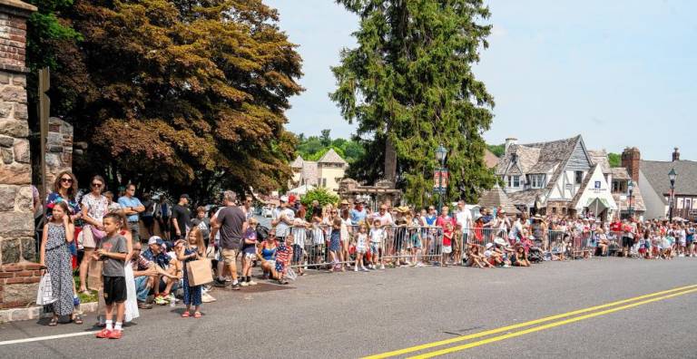 People line the street waiting for the parade.