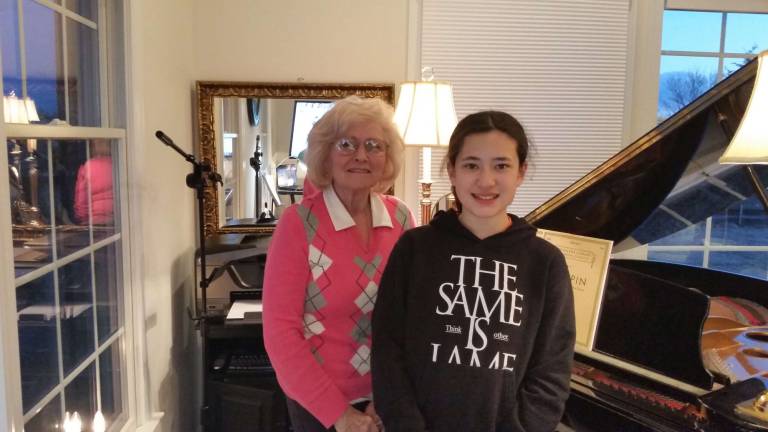 Piano teacher Joan Farrington is pictured with Maiki Batchelor.