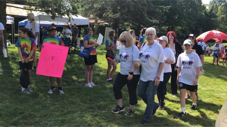 From left, in tie-dyed T-shirts, are Bella Luciano, Chase Diaz, Marissa Bonaparte, Eloise Demeter and Gia Gutierrez, all part of the Center for Prevention &amp; Counseling’s summer youth action groups.