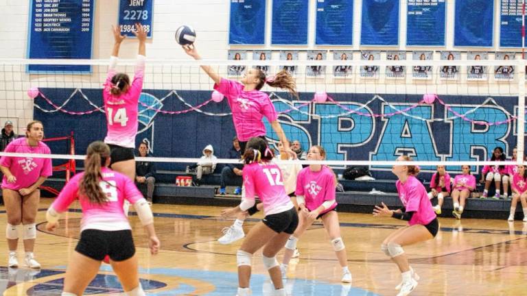 SV1 Sparta's Sylvia Przydzial gets a hand on the ball above the net in the game against Roxbury at home Oct. 14. The Spartans won 25-22, 25-20. (Photos by George Leroy Hunter)