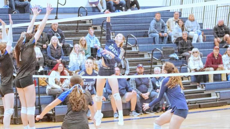 Sparta's Aralyn Saulys hits the ball in the semifinal round of the NJSIAA North Jersey, Section 1, Group 2 tournament at home Nov. 9. The Spartans beat Demarest 25-23, 25-10. Saulys made four kills, five digs and seven assists. (Photos by George Leroy Hunter)