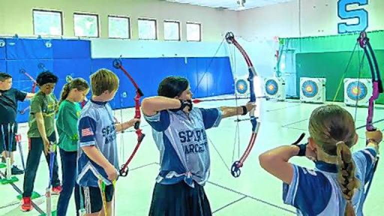 The archery team at Helen Morgan School practices. (Photos by Olivia Flanz)