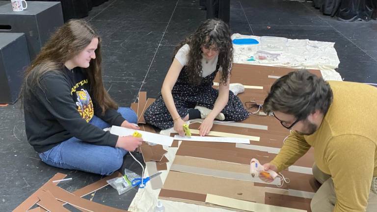 From left, Dana Nigro of Stillwater, Isabella Cruz of Vernon and Anthony Guerra of Milford, Pa., build the set for ‘Aesop &amp; His Fabled Friends.’